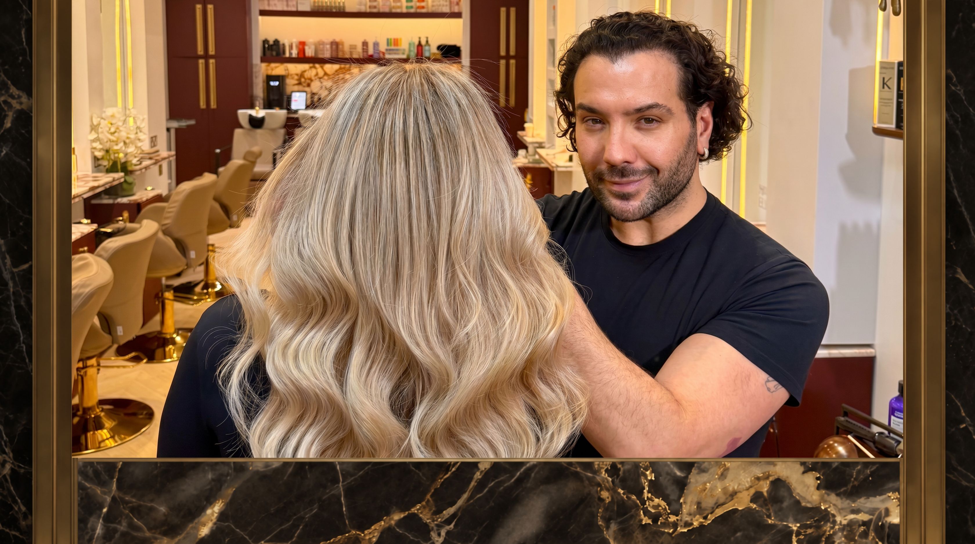 Hakim Elhocine finishing couture hair at the Mayfair atelier